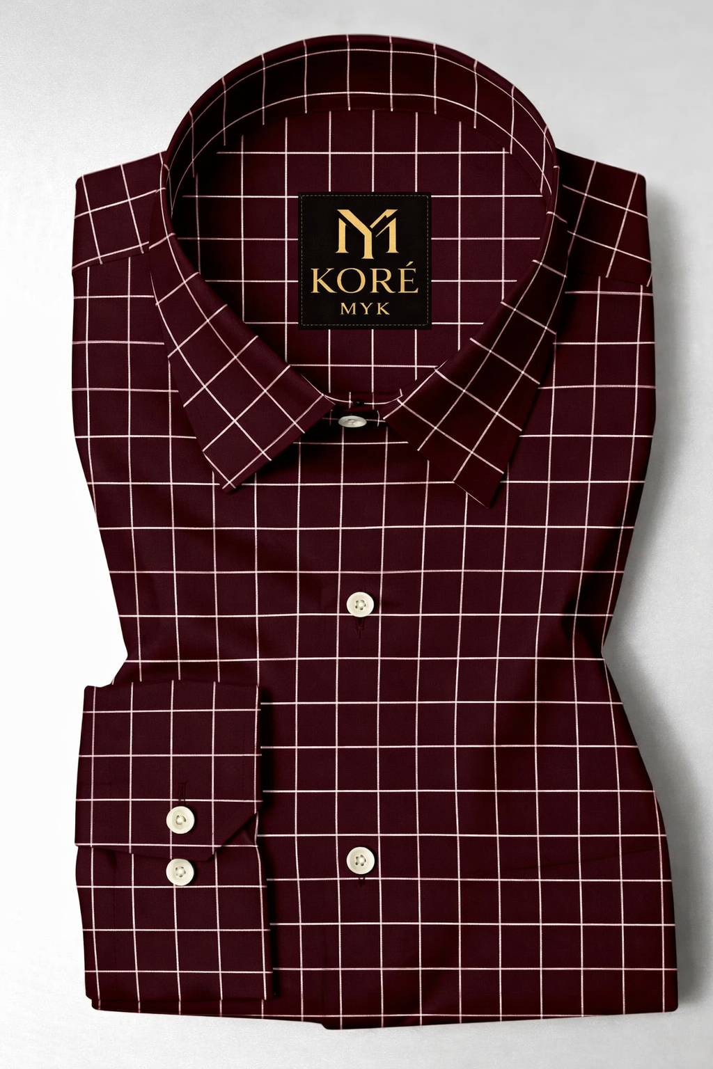 Maroon checkered shirt with Kore MYK label on a white background