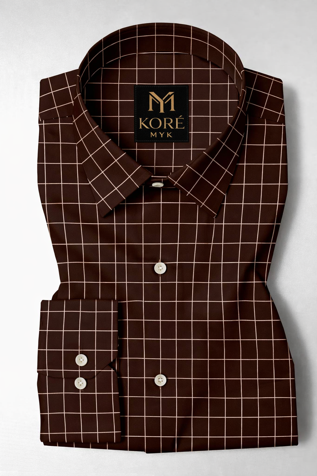 Brown checkered shirt with a Kore label on a white background